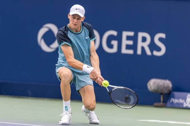 August 8, 2024, Montreal, Quebec, Canada: JANNIK SINNER from Italia backhand shot with almost a knee on the ground in second set against Borna Coric from Croatia in second round of Canadian Open at IGA Stadium in Montreal, Quebec, Canada Montreal Canada - ZUMAl189 20240808_zsp_l189_056 Copyright: xYannickxLegarex