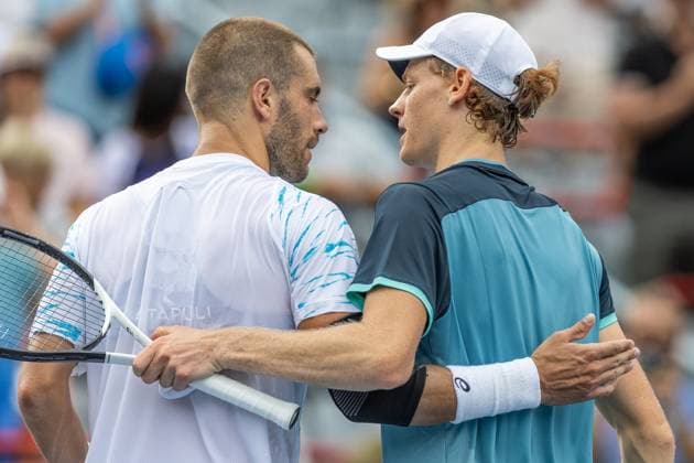 August 8, 2024, Montreal, Quebec, Canada: JANNIK SINNER from Italia and BORNA CORIC from Croatia walking back to their bench together in second round of Canadian Open at IGA Stadium in Montreal, Quebec, Canada. View for behind Montreal Canada - ZUMAl189 20240808_zsp_l189_072 Copyright: xYannickxLegarex