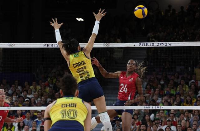 Team USA (red jersey) plays against Team Brazil (yellow jersey) during the Women s Volleyball semi-final of the 2024 Summer Olympics at the South Arena, in Paris, France, on Thursday, August 8, 2024. Team USA qualified for the final.  OLY202408062616 MAYAxVIDON-WHITE