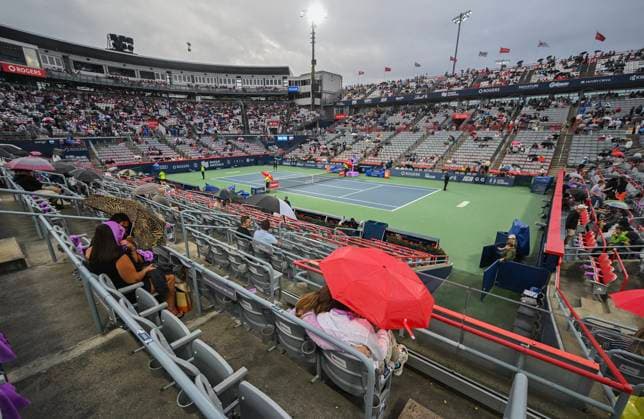 August 8, 2024, Montreal, Pq, Canada: People sit with umbrellas on centre court during a rain stoppage ahead of the second round match between Thanasi Kokkinakis of Australia and Hubert Hurkacz of Poland at the National Bank Open tennis tournament in Montreal, Thursday, August 8, 2024. National Bank Tennis,  - ZUMAc35_ 20240808_zaf_c35_163 Copyright: xGrahamxHughesx