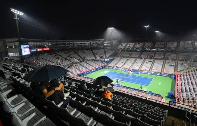 August 8, 2024, Montreal, Pq, Canada: People sit with umbrellas on centre court as rain falls at the National Bank Open tennis tournament in Montreal, Thursday, August 8, 2024. National Bank Open Tennis,  - ZUMAc35_ 20240808_zaf_c35_180 Copyright: xGrahamxHughesx
