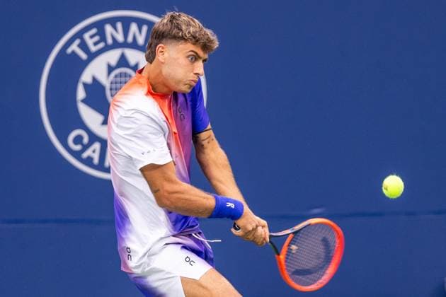 August 8, 2024, Montreal, Quebec, Canada: FLAVIO COBOLLI from Italia returning ball in first set against Arthur Rinderknech from France in second round of Canadian Open at IGA Stadium in Montreal, Quebec, Canada. View from opposite side with Tennis Canada logo in background Montreal Canada - ZUMAl189 20240808_zsp_l189_083 Copyright: xYannickxLegarex