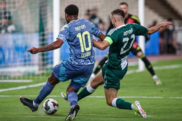 2024-08-08 Panathinaikos FC v AFC Ajax - Europa League Qualifier Third Round - 1st leg ATHENS, NETHERLANDS - AUGUST 8: Chuba Akpom of AFC Ajax, Giannis Kotsiras of Panathinaikos FC battle for the ball during the Europa League Qualifier Third Round - 1st leg match between Panathinaikos FC and AFC Ajax at Olympic Stadium Spyridon Louis on August 8, 2024 in Athens, Netherlands. Athens Olympic Stadium Spyridon Louis Netherlands Content not available for redistribution in The Netherlands directly or indirectly through any third parties. Copyright: xx
