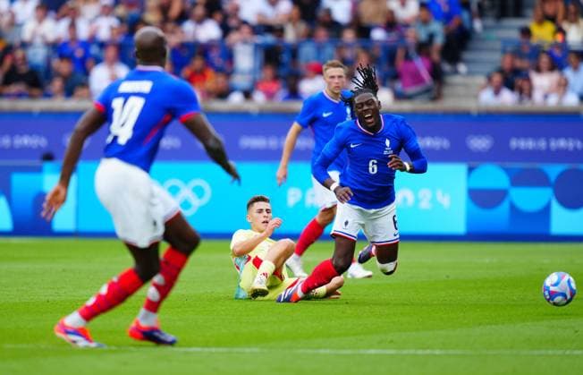 Fermin Lopez of Spain fouls Manu Kone of France during the Olympic Men s Football Final, France v Spain Paris 2024 Olympic Games, Olympische Spiele, Olympia, OS Day Fourteen, Paris, France - 09 Aug 2024 EDITORIAL USE ONLY No use with unauthorised audio, video, data, fixture lists (outside the EU), club league logos or live services. Online in-match use limited to 45 images (+15 in extra time). No use to emulate moving images. No use in betting, games or Copyright: xJavierxGarcia Shutterstockx 14622991aq