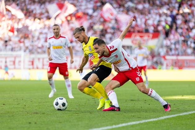 09 08 2024, Football, GER, Season, 2 Liga, Season 2024 2025, SSV Jahn Regensburg SSV Ulm 1846 Soccer Dennis Chessa vs Oscar Schönfelder SSV Jahn Regensburg DFL REGULATIONS PROHIBIT ANY USE OF PHOTOGRAPHS AS IMAGE SEQUENCES AND OR QUASI VIDEO Regensburg Bavaria Germany Jahnstadion Regensburg