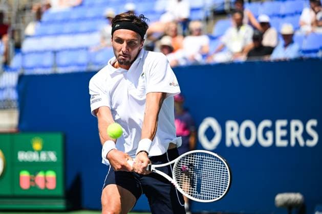 MONTREAL, QC - AUGUST 10: Arthur Rinderknech (FRA) returns the ball during a second round match at ATP, Tennis Herren National Bank Open on August 10, 2024 at IGA Stadium in Montreal, QC (Photo by David Kirouac Icon Sportswire) TENNIS: AUG 10 National Bank Open EDITORIAL USE ONLY Icon240810011