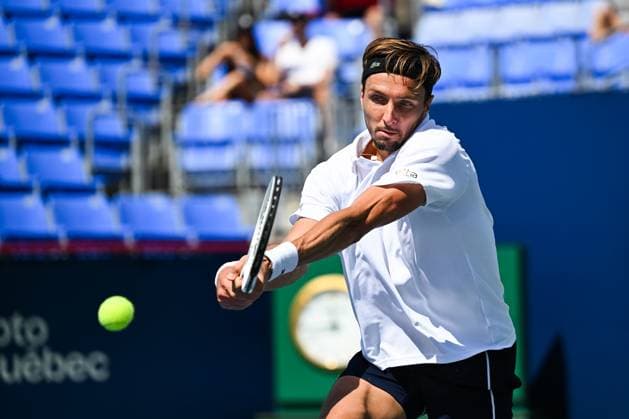 MONTREAL, QC - AUGUST 10: Arthur Rinderknech (FRA) returns the ball during a second round match at ATP, Tennis Herren National Bank Open on August 10, 2024 at IGA Stadium in Montreal, QC (Photo by David Kirouac Icon Sportswire) TENNIS: AUG 10 National Bank Open EDITORIAL USE ONLY Icon240810014
