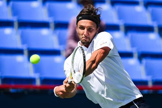MONTREAL, QC - AUGUST 10: Arthur Rinderknech (FRA) returns the ball during a second round match at ATP, Tennis Herren National Bank Open on August 10, 2024 at IGA Stadium in Montreal, QC (Photo by David Kirouac Icon Sportswire) TENNIS: AUG 10 National Bank Open EDITORIAL USE ONLY Icon240810016