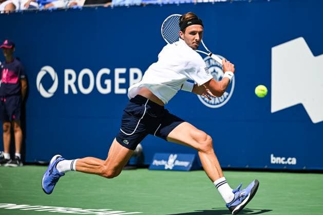 MONTREAL, QC - AUGUST 10: Arthur Rinderknech (FRA) returns the ball during a second round match at ATP, Tennis Herren National Bank Open on August 10, 2024 at IGA Stadium in Montreal, QC (Photo by David Kirouac Icon Sportswire) TENNIS: AUG 10 National Bank Open EDITORIAL USE ONLY Icon240810018