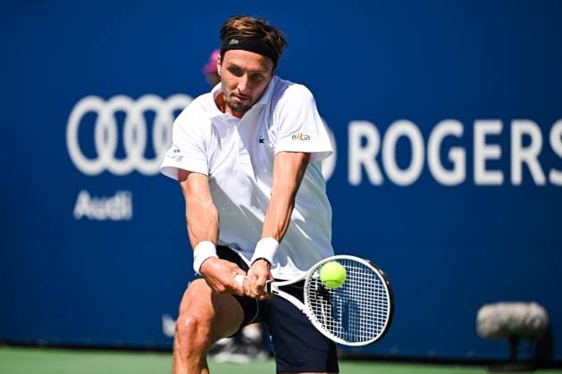 MONTREAL, QC - AUGUST 10: Arthur Rinderknech (FRA) returns the ball during a second round match at ATP, Tennis Herren National Bank Open on August 10, 2024 at IGA Stadium in Montreal, QC (Photo by David Kirouac Icon Sportswire) TENNIS: AUG 10 National Bank Open EDITORIAL USE ONLY Icon240810021