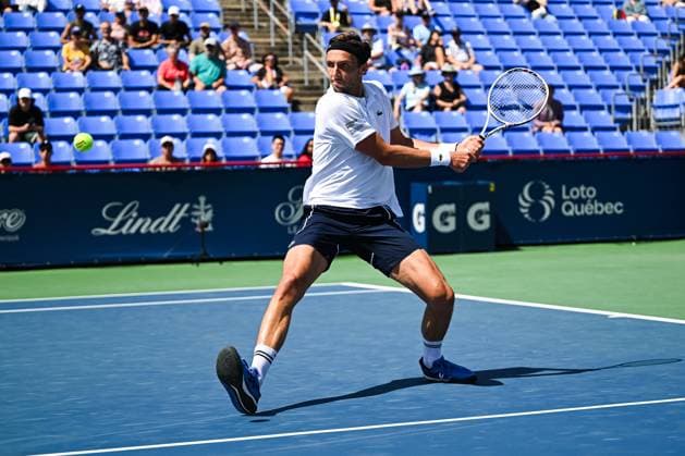 MONTREAL, QC - AUGUST 10: Arthur Rinderknech (FRA) returns the ball during a second round match at ATP, Tennis Herren National Bank Open on August 10, 2024 at IGA Stadium in Montreal, QC (Photo by David Kirouac Icon Sportswire) TENNIS: AUG 10 National Bank Open EDITORIAL USE ONLY Icon240810024