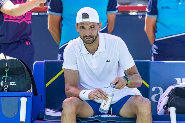 August 10, 2024, Montreal, Quebec, Canada: GRIGOR DIMITROV from Bulgaria sitting at his bench looking strait at camera between point in first set against Alexei Popyrin from Australia in third round of Canadian Open at IGA Stadium in Montreal, Quebec, Canada Montreal Canada - ZUMAl189 20240810_zsp_l189_021 Copyright: xYannickxLegarex