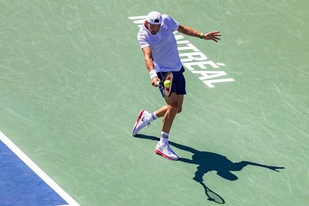 August 10, 2024, Montreal, Quebec, Canada: GRIGOR DIMITROV from Bulgaria hitting ball backhand in second set against Andrey Rublev in third round of Canadian Open at IGA Stadium in Montreal, Quebec, Canada. View from high point. Ball on racket Montreal Canada - ZUMAl189 20240810_zsp_l189_023 Copyright: xYannickxLegarex