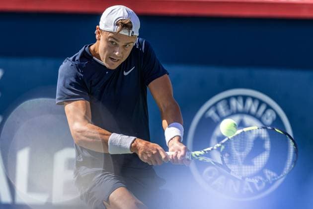 August 10, 2024, Montreal, Quebec, Canada: HOLGER RUNE from Denmark backhand hit in first set against Alexander Zverev from Germany in third round of Canadian Open at IGA Stadium in Montreal, Quebec, Canada Montreal Canada - ZUMAl189 20240810_zsp_l189_039 Copyright: xYannickxLegarex