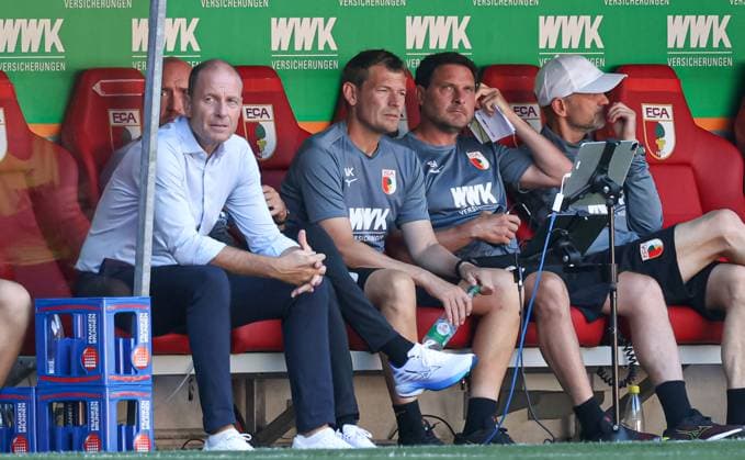 v li Jess Thorup coach FC Augsburg , Lars Knudsen co-coach FC Augsburg , Imre Szabics co-coach FC Augsburg and Marco Langner goalkeeper coach FC Augsburg on the bench FC Augsburg vs Olympique Marseille, test match