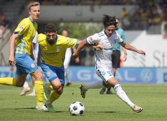 Duel between Fabio Kaufmann Eintracht Braunschweig and Tatsuya Ito 1 FC Magdeburg Football, Men, Season 2024 2025 2 BL, Eintracht Stadion, Eintracht Braunschweig vs 1 FC Magdeburg, 1 3 DFL REGULATIONS PROHIBIT ANY USE OF PHOTOGRAPHS AS IMAGE SEQUENCES AND OR QUASI VIDEO