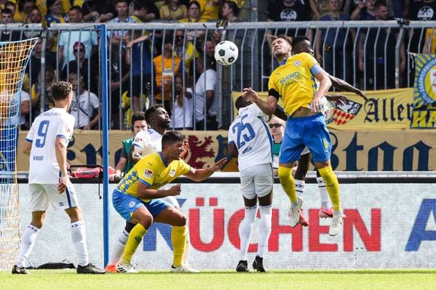 Ermin Bicakcic Eintracht Braunschweig,6 and Jannis Nikolaou Eintracht Braunschweig,4 vs Silas Gnaka 1 FC Magdeburg,25 and Daniel Heber 1 FC Magdeburg,15 2 Soccer Bundesliga Season 2024 2025 Eintracht Braunschweig vs 1 FC Magdeburg at Eintracht Stadion in Braunschweig Action,Soccer,Man,Men,Germany,11 08 2024