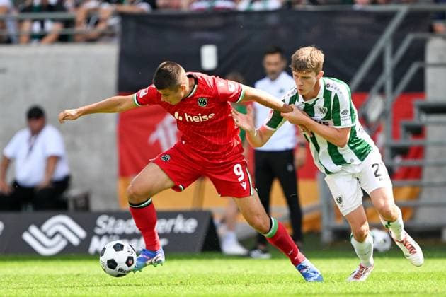 2 Bundesliga SC Preußen Münster Hannover 96 on 11 08 2024 at the Preußenstadion in Münster Nicolo Tresoldi Hannover 96 in a duel against Jano ter Horst Muenster MT