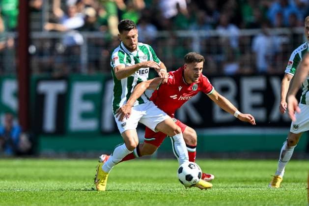2 Bundesliga SC Preußen Münster Hannover 96 on 11 08 2024 at the Preußenstadion in Münster Babis Makridis Muenster in a duel against Enzo Leopold Hannover 96 MT