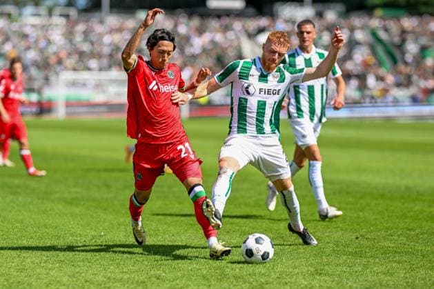2 Bundesliga SC Preußen Münster Hannover 96 on 11 08 2024 at the Preußenstadion in Münster Sei Muroya Hannover 96 in a duel against Mikkel Kirkeskov Muenster MT