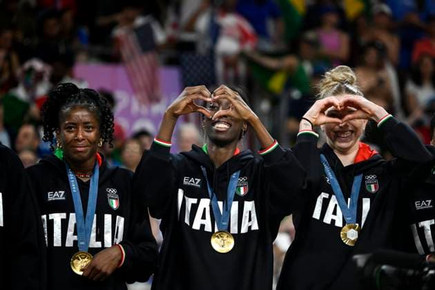 Myriam Fatime Sylla, Paola Ogechi Egonu and Sarah Luisa Fahr of Italy celebrate at the end of the Volleyball gold medal match between United States of America and Italy of the Paris 2024 Olympic Games, Olympische Spiele, Olympia, OS at Arena Paris Sud 1 in Paris (France), August 11, 2024. Italy defeated United States 3-0 and won the gold medal.