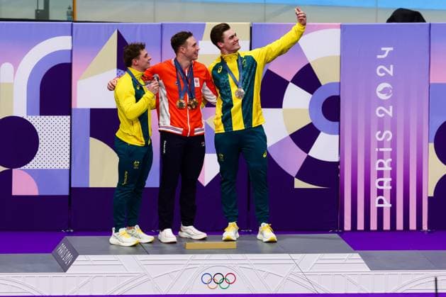 PARIS, FRANCE - AUGUST 11: Harrie Lavreysen of Team Netherlands takes a selfie after winning Gold on the Podium with Matthew Glaetzer of Team Australia and Matthew Richardson of Team Australia in the Men™s Keirin Final during the Cycling Track Paris 2024 Olympic Games, Olympische Spiele, Olympia, OS at the National Veladrome on August 11, 2024 in Paris, France. (Photo by Pete Dovgan Speed Media Icon Sportswire) OLYMPICS: AUG 11 Paris 2024 EDITORIAL USE ONLY Icon2408110212