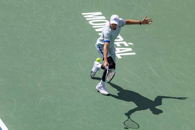 August 11, 2024, Montreal, Quebec, Canada: HUBERT HURKACZ from Poland backhand shot in first set against Alexei Popyrin from Australia in quarter final of Canadian Open at IGA Stadium in Montreal, Quebec, Canada. View from high point with Montreal logo and hard shadow Montreal Canada - ZUMAl189 20240811_zsp_l189_008 Copyright: xYannickxLegarex