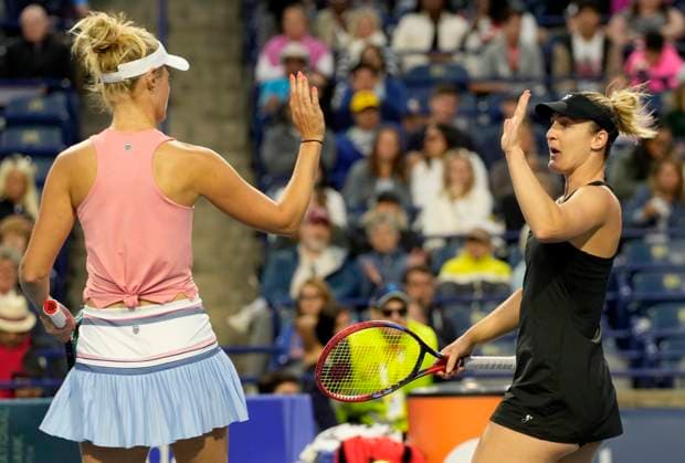 August 11, 2024, Toronto, On, CANADA: Gabriela Dabrowski, right, of Ottawa, high fives teammate Erin Routliffe, of New Zealand, after winning the first set against Leylah Fernandez, of Montreal, and teammate and sister Bianca Jolie Fernandez during women s doubles semifinal action against at the National Bank Open, in Toronto, Sunday, Aug. 11, 2024. Canada News - August 11, 2024  - ZUMAc35_ 20240811_zaf_c35_113 Copyright: xFrankxGunnx