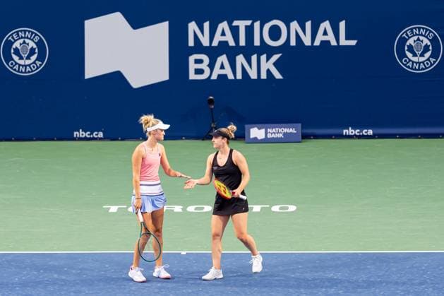 TORONTO, ON - AUGUST 11: Gabriela Dabrowski of Canada (R) and Erin Routliffe of New Zealand (L) celebrate after winning a point during their semi-final doubles match of the National Bank Open, part of the WTA, Tennis Damen Tour, at Sobeys Stadium on August 11, 2024 in Toronto, Canada. (Photo by Julian Avram Icon Sportswire) TENNIS: AUG 11 National Bank Open EDITORIAL USE ONLY Icon2408110030