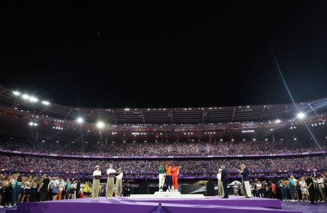 (240811) -- PARIS, Aug. 11, 2024 -- Gold medalist Sifan Hassan (C) of the Netherlands, silver medalist Tigst Assefa (L) of Ethiopia and bronze medalist Hellen Obiri of Kenya pose for photos during the victory ceremony of women s marathon of Athletics at the closing ceremony of the Paris 2024 Olympic Games, Olympische Spiele, Olympia, OS at the Stade de France in Paris, France, Aug. 11, 2024. ) (PARIS2024) FRANCE-PARIS-OLY-CLOSING CEREMONY CaoxCan 