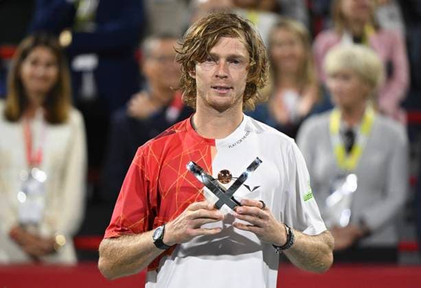 August 12, 2024, Montreal, Pq, Canada: Andrey Rublev, of Russia, holds up the runners up trophy after losing to Alexei Popyrin, of Australia, in the final of the National Bank Open men s tennis tournament in Montreal, Monday, Aug. 12, 2024. Alexei Popyrin, Andrey Rublev, - ZUMAc35_ 20240812_zaf_c35_141 Copyright: xGrahamxHughesx