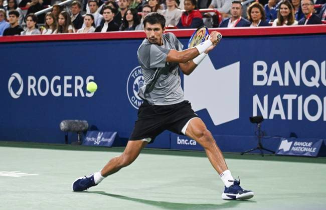 August 12, 2024, Montreal, Pq, Canada: Alexei Popyrin, of Australia, plays a shot to Andrey Rublev, of Russia, during the final of the National Bank Open men s tennis tournament in Montreal, Monday, Aug. 12, 2024. Alexei Popyrin, Andrey Rublev, - ZUMAc35_ 20240812_zaf_c35_142 Copyright: xGrahamxHughesx
