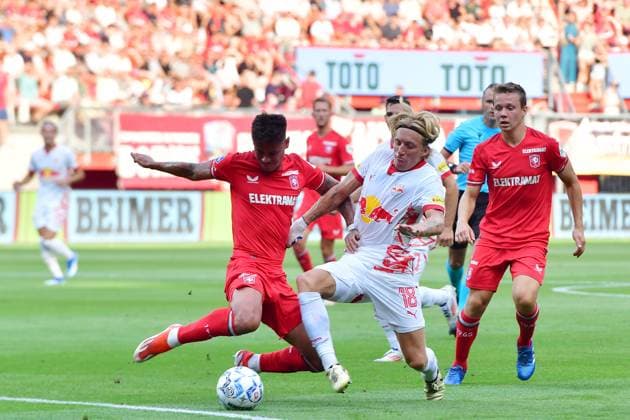 ENSCHEDE, 13-08-2024 , Stadium de Grolsch Veste, football, UEFA Champions League, qualification, season 2024 2025, FC Twente - Salzburg. FC Twente player Mees Hilgers and Salzburg player Mads Bidstrup Twente - Salzburg  x26028445x Copyright:
