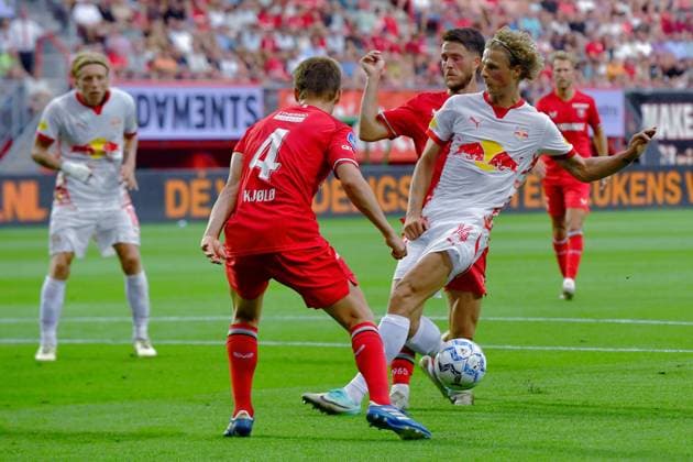 ENSCHEDE, 13-08-2024 , Stadium de Grolsch Veste, football, UEFA Champions League, qualification, season 2024 2025, FC Twente - Salzburg. FC Twente player Ricky van Wolfswinkel and Salzburg player Maurits Kjaergaard Twente - Salzburg  x26028653x Copyright: