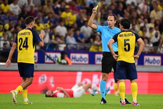 Union s Charles Vanhoutte receives a yellow card from the referee during a soccer game between Belgian Royale Union Saint-Gilloise and Czech SK Slavia Praha, on Tuesday 13 August 2024 in Anderlecht, Brussels, the return leg of the third qualifying round for the UEFA Champions League competition. Praha won the first leg 3-1. LAURIExDIEFFEMBACQ  x98417227x