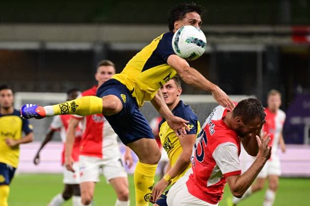 Union s Kevin Mac Allister and Slavia Prague s Tomas Chory fight for the ball during a soccer game between Belgian Royale Union Saint-Gilloise and Czech SK Slavia Praha, on Tuesday 13 August 2024 in Anderlecht, Brussels, the return leg of the third qualifying round for the UEFA Champions League competition. Praha won the first leg 3-1. LAURIExDIEFFEMBACQ  x98417897x
