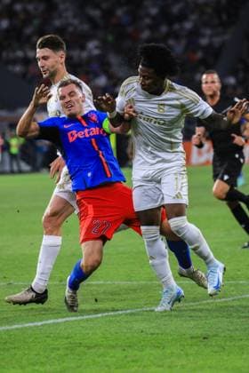 13 august 2024,Stadionul Steaua, Bucharest, UEFA Champions League, Third qualifying round, 2nd leg, FCSB(ROU) vs Sparta Praha (CZE) 27 Darius Olaru brings the ball forward and gets tacckle by the defender