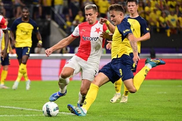 Slavia Prague s Tomas Holes and Union s Dennis Eckert Ayensa fight for the ball during a soccer game between Belgian Royale Union Saint-Gilloise and Czech SK Slavia Praha, on Tuesday 13 August 2024 in Anderlecht, Brussels, the return leg of the third qualifying round for the UEFA Champions League competition. Praha won the first leg 3-1. LAURIExDIEFFEMBACQ  x98420994x