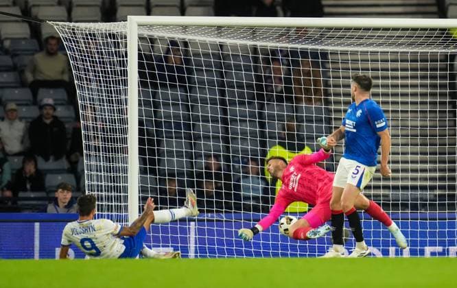 Nazar Voloshyn of Dynamo Kyiv beats Rangers goalkeeper Jack Butland and scores to give Kyiv a 0-2 lead. Rangers v Dynamo Kyiv, UEFA Champions League, Third Qualifying Round, Second Leg, Football, Hampden Park, Glasgow, UK, 13 Aug 2024 EDITORIAL USE ONLY No use with unauthorised audio, video, data, fixture lists, club league logos or live services. Online in-match use limited to 120 images, no video emulation. No use in betting, games or single club league player publications. Copyright: xStuartxWallace Shutterstockx 14633326bk