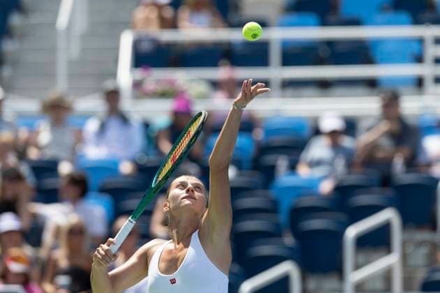 August 13, 2024, Mason, Oh, USA: 2024 Cincinnati Open Tennis, 2024 08 13 - Marta Kostyuk serves a ball against opponent Elise Mertens. ZUMAPress Mason USA - ZUMAn24_ 20240813_zaf_n24_087 Copyright: xWallyxNellx