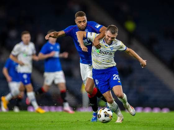 13th August 2024; Hampden Park, Glasgow, Scotland; Champions League Qualifying Football, Second Leg, Rangers versus Dynamo Kyiv; Cyriel Dessers of Rangers is held off by Oleksandr Karavaiev of Dynamo Kyiv  ActionPlus12681437 VagelisxGeorgariou