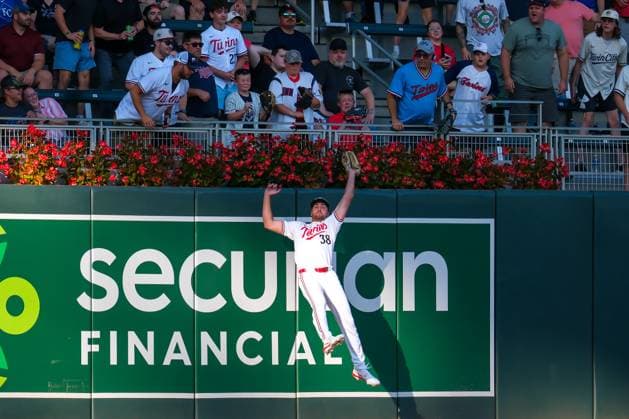 August 13, 2024, Minneapolis, Minnesota, USA: Minnesota Twins left fielder MATT WALLNER (38) makes a jumping catch on a fly ball hit by Kansas City Royals second baseman MICHAEL MASSEY (19) during a MLB, Baseball Herren, USA game between the Minnesota Twins and the Kansas City Royals at Target Field. The Twins won 13-3. Minneapolis USA - ZUMAg254 20240813_zsp_g254_047 Copyright: xStevenxGarciax