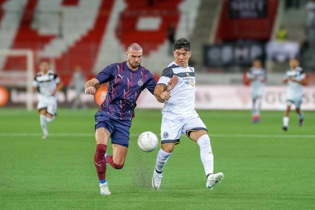 Football UEFA EURO LEAGUE 2024 2025 3rd qualifying round FC LUGANO SUI vs PARTIZAN BELGRAD SRB , Arena Thun, Switzerland Nihad Mujakic Partizan and Ignacio Aliseda Lugano 31 in a duel Thun SUI Copyright: xJOERANxSTEINSIEKx