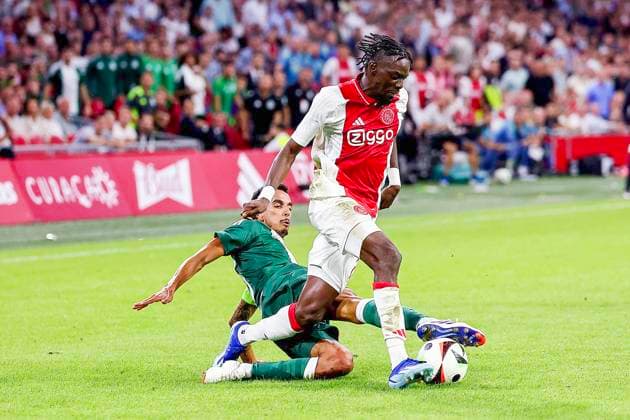 AMSTERDAM, 15-08-2024 , JohanCruyffStadium Football UEFA Europa League qualifier season 2024 2025. Ajax player Bertrand Traore vs Panathinaicos player Daniel Mancini during the match Ajax - Panathinaikos. Ajax - Panathinaikos  x26038138x Copyright: