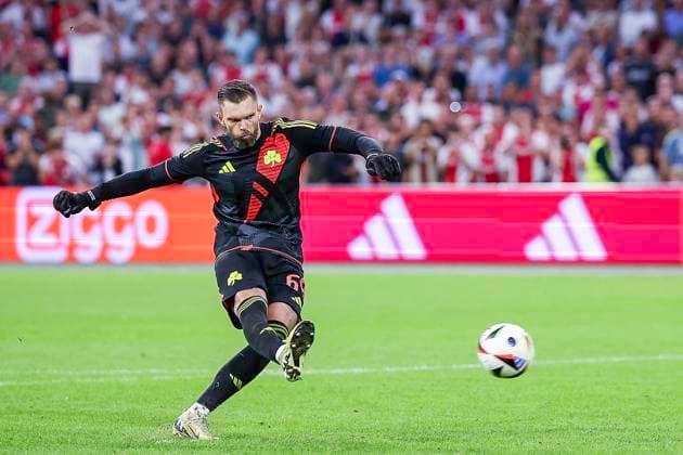 AMSTERDAM, 15-08-2024 , JohanCruyffStadium Football UEFA Europa League qualifier season 2024 2025. Panathinaicos goalkeeper Bartlomiej Dragowski scores penalty during the match Ajax - Panathinaikos. Ajax - Panathinaikos  x26038394x Copyright: