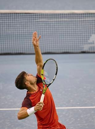 CINCINNATI, OH - AUGUST 15: Carlos Alcaraz of Spain serves the ball in his match against Gael Monfils of France during the second round of the Cincinnati Open at the Lindner Family Tennis Center on August 15, 2024 in Mason, OH. (Photo by Shelley Lipton Icon Sportswire) TENNIS: AUG 15 Western & Southern Open EDITORIAL USE ONLY Icon2408156450