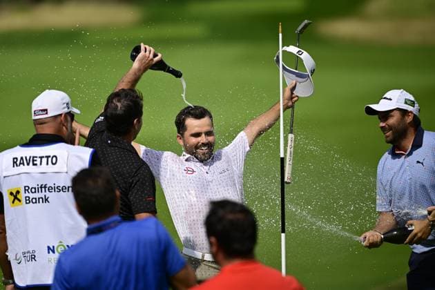 David Ravetto of France, center, celebrates after winning the Czech Masters golf tournament of DP World Tour European series in Nebrenice, Czech Republic, August 18, 2024. (CTKxPhoto RomanxVondrous) CTKPhotoP2024081802780  CTKPhotoP2024081802780