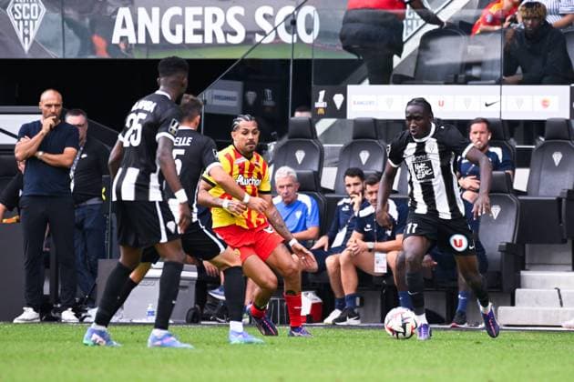 Sidiki CHERIF ( 11 - Angers ) and Facundo Axel MEDINA ( 14 - Lens ) during the Ligue 1 match between Angers SCO and RC Lens at Stade Raymond Kopa on August 18, 2024 in Angers, France. ( Photo by federico pestellini panoramic ) - FOOTBALL : Angers vs Lens - Ligue 1 - 18 08 2024 FedericoPestellini Panoramic 