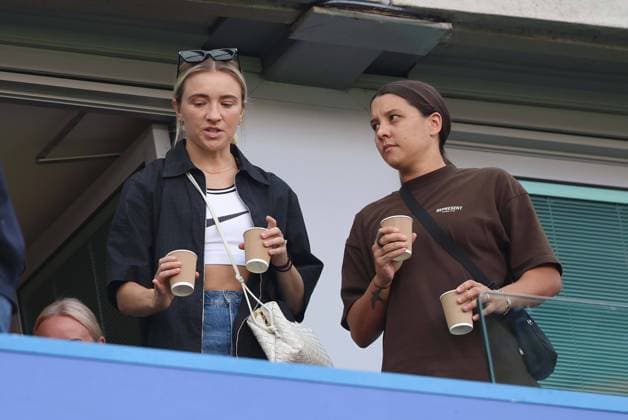 Sam Kerr of Chelsea & Australia watches on with girlfriend Kristie Mewis. - Chelsea v Manchester City, Premier League, London Stadium, London, UK - 18th August 2024. Editorial Use Only - DataCo restrictions apply. Chelsea v Manchester City, Premier League, Football, Stamford Bridge, London, UK - 18 Aug 2024 EDITORIAL USE ONLY No use with unauthorised audio, video, data, fixture lists, club league logos or live services. Online in-match use limited to 120 images, no video emulation. No use in betting, games or single club league player publications. Copyright: xMDI Shutterstockx 14643068c