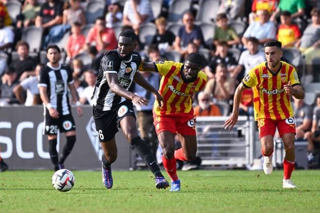 Jean Eudes Aholou ( 6 - Angers ) and Kevin Danso ( 4 - Lens ) during the Ligue 1 match between Angers SCO and RC Lens at Stade Raymond Kopa on August 18, 2024 in Angers, France. ( Photo by federico pestellini panoramic ) - FOOTBALL : Angers vs Lens - Ligue 1 - 18 08 2024 FedericoPestellini Panoramic 